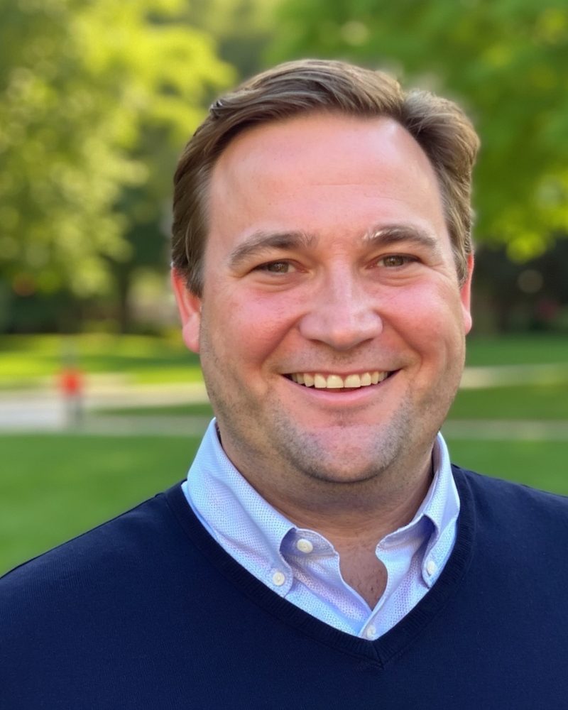 Daniel Hunt, founder of Infoloop, outdoors in a navy sweater